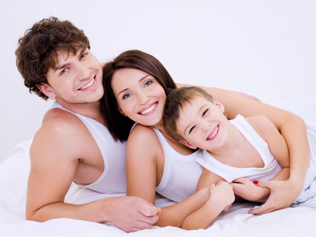 beautiful-son-embraces-happy-cheerful-parents - The Shoreline Center for Laser & Cosmetic Surgery Mommy makeover at guilford & madison connecticut